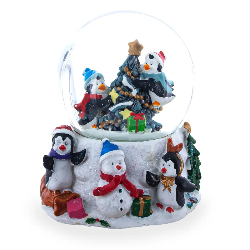 Penguins' Festive Tree Celebration Snow Water Globe