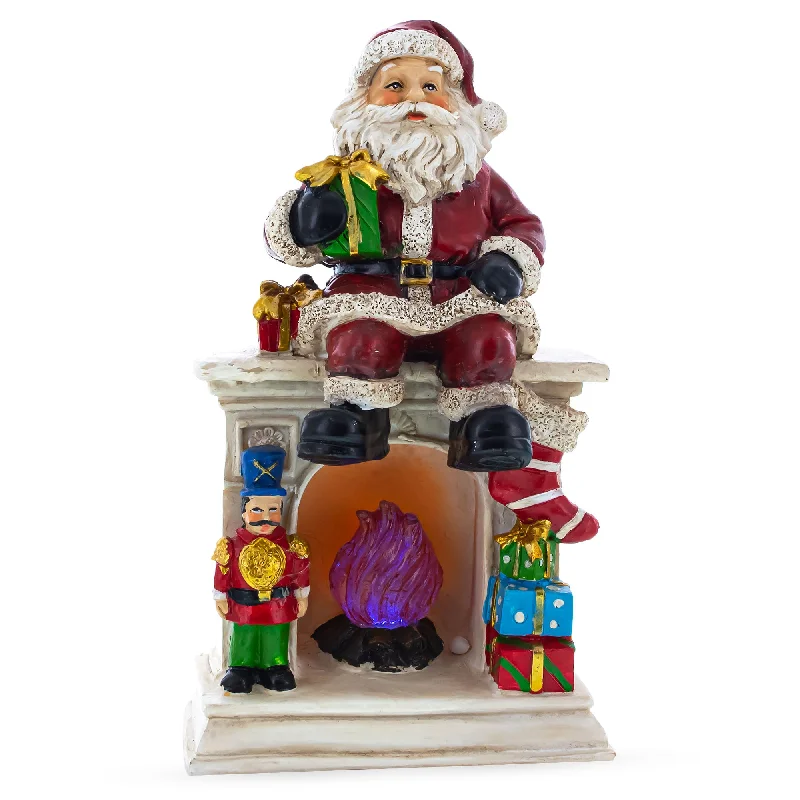 Santa Sitting on a Fireplace LED Lights Figurine 7.75 Inches